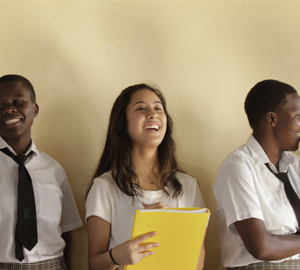 WISER girls and a visitor laughing.